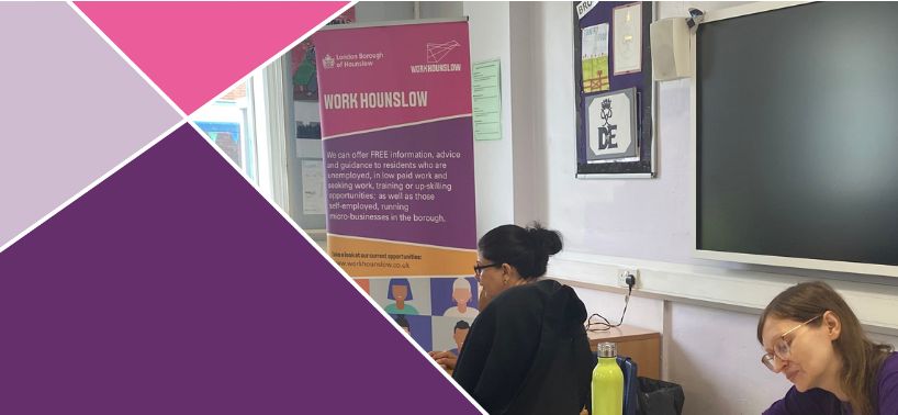 Students working at desks in classroom with 'Work Hounslow' employment service poster on wall featuring pink and purple geometric design